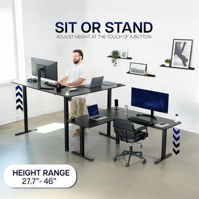 Height-adjustable desk with a man working at a modern office setup.