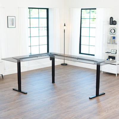 Modern office black, desk frame in a bright room with large windows.