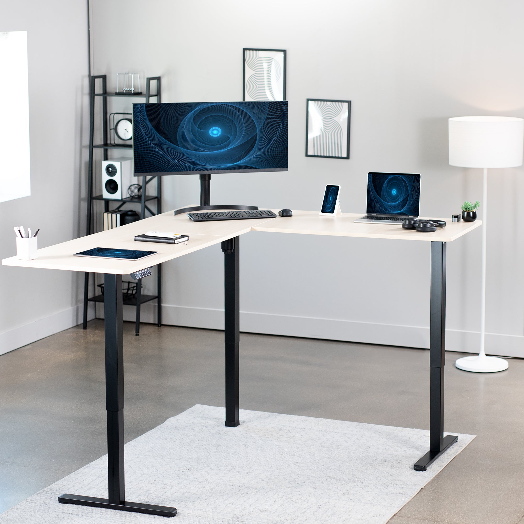 Electric heavy-duty corner desk workstation for modern office workspaces.