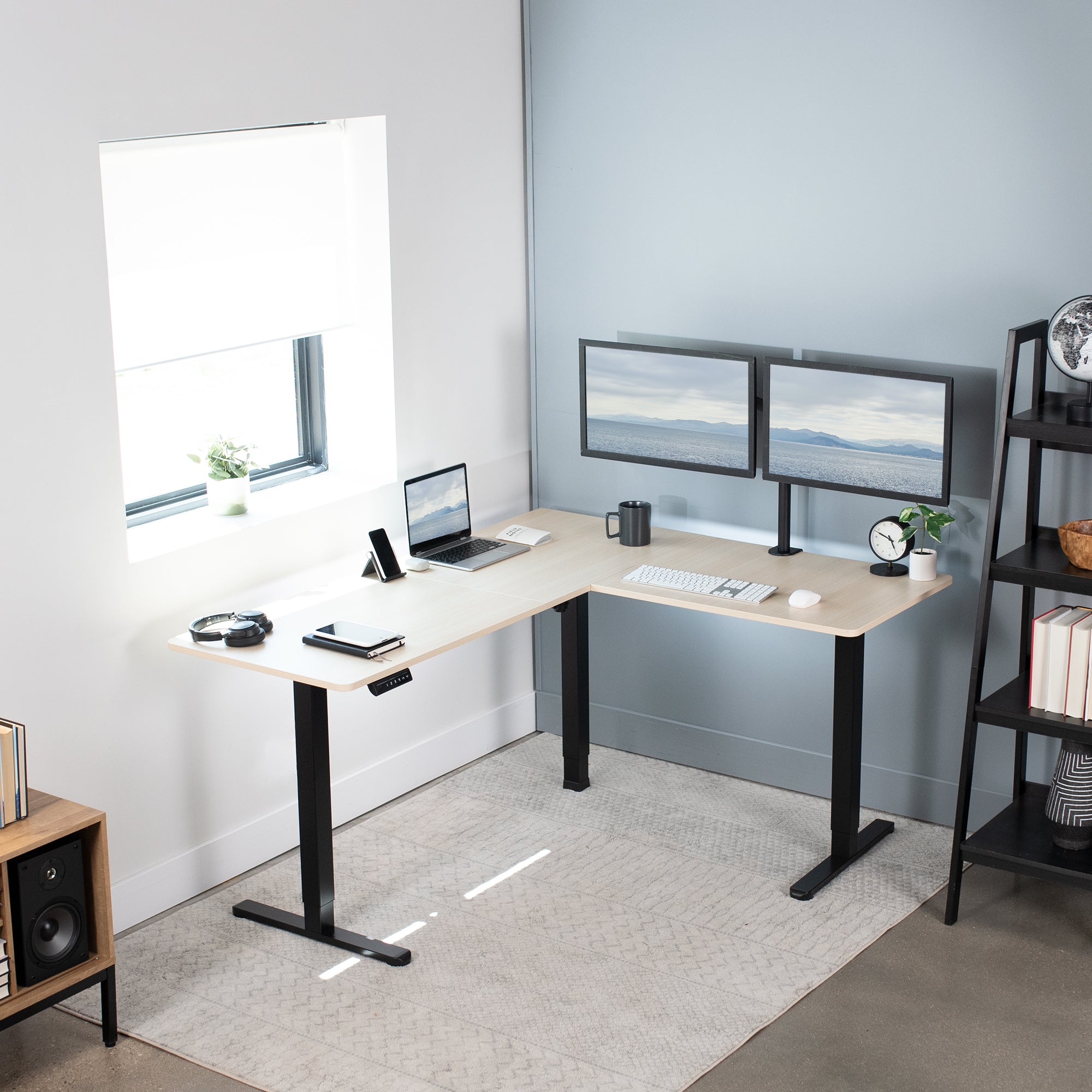 Electric heavy-duty corner desk workstation for modern office workspaces.