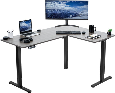 Electric heavy-duty corner desk workstation for modern office workspaces.