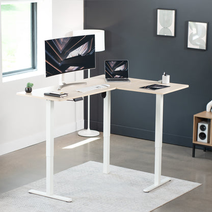 Electric heavy-duty corner desk workstation for modern office workspaces.