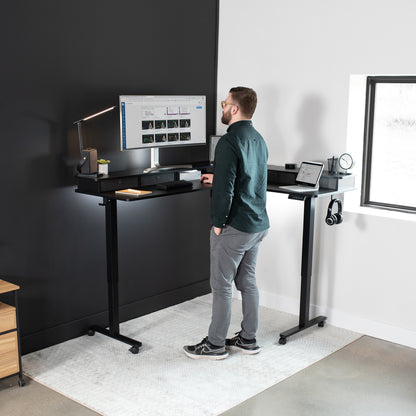 Spacious workstation surface with built-in shelving supporting multiple monitors.