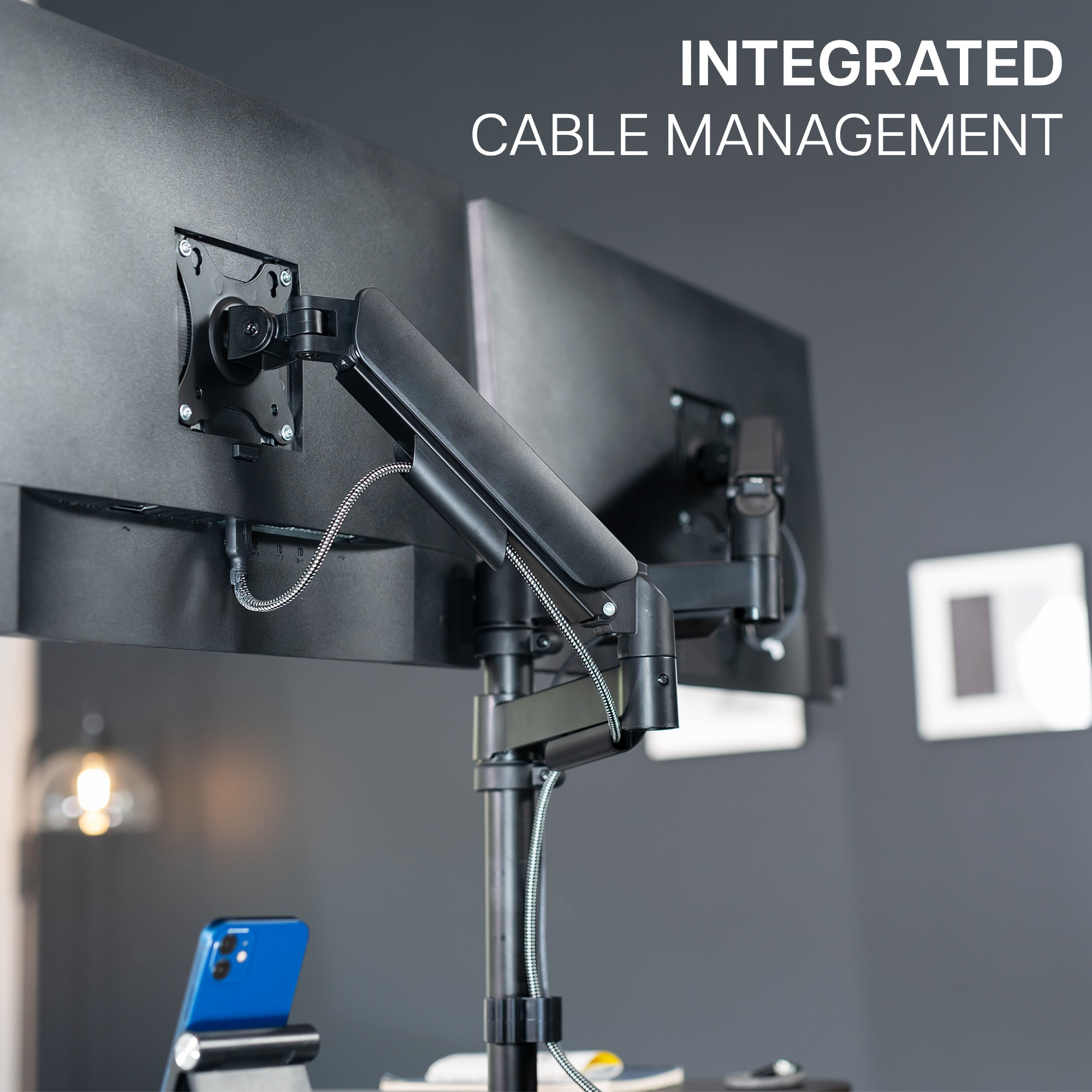 36 inch height adjustable desk riser with articulating mechanical dual monitor mount.