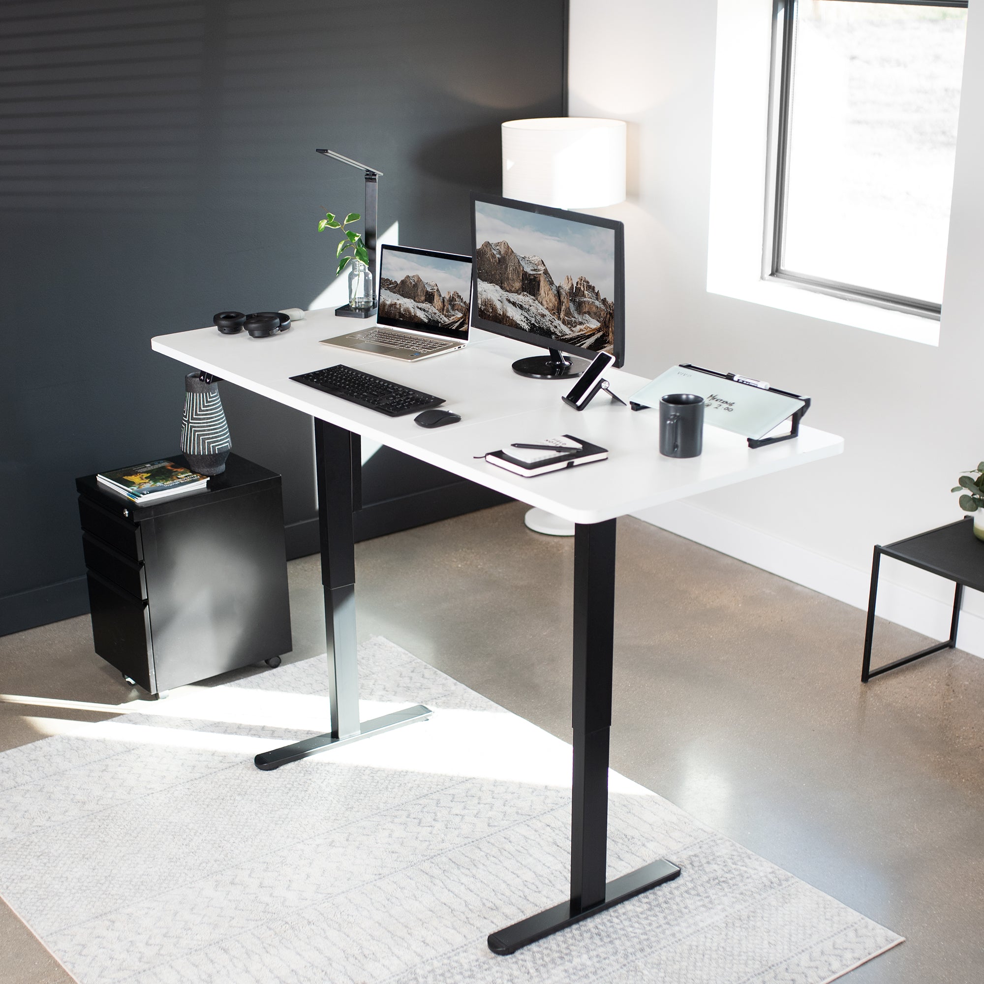 Wide surface sturdy sit or stand active workstation with adjustable height using 2 button control panel.