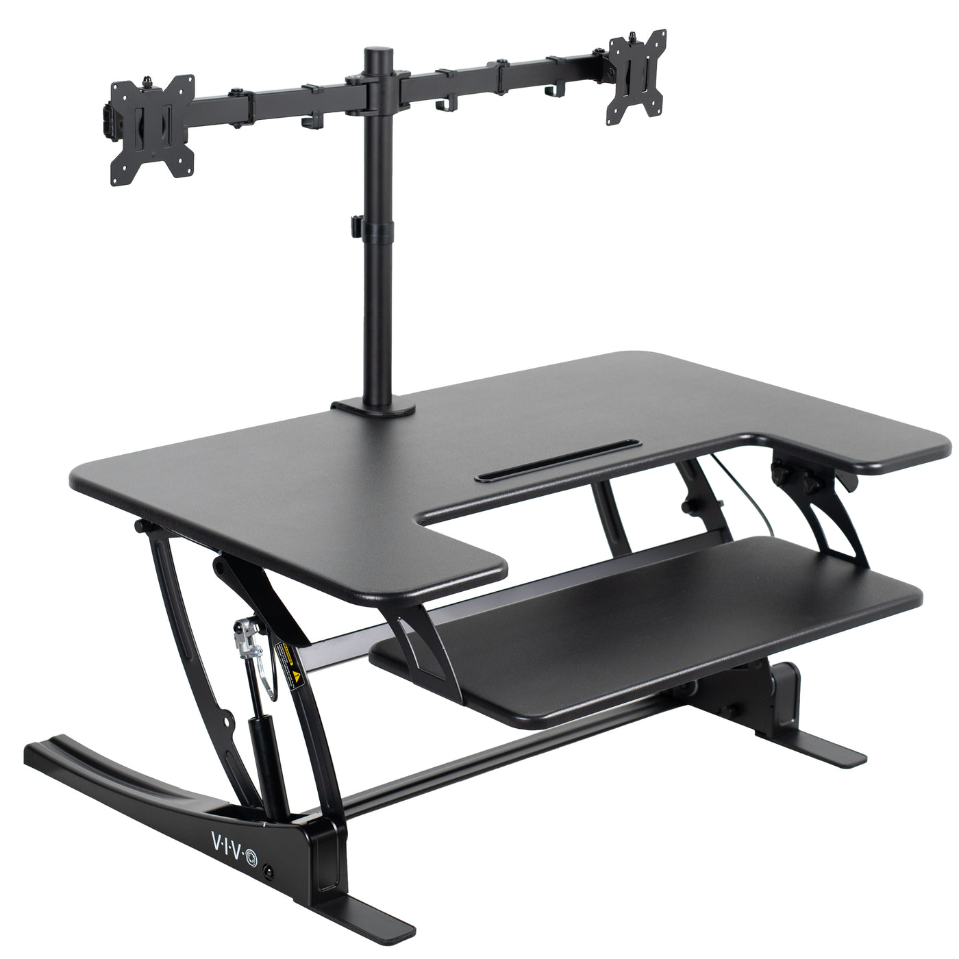 Height adjustable desk riser with articulating dual monitor mount.