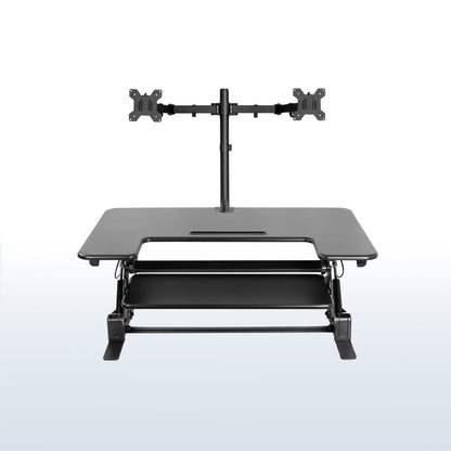 Height adjustable desk riser with articulating dual monitor mount.