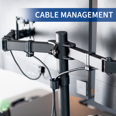 Height adjustable desk riser with articulating dual monitor mount featuring cable management.