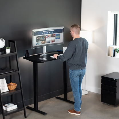 Sturdy ergonomic sit or stand active desk workstation with adjustable height using smart control panel.