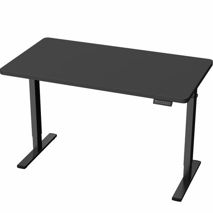 Black, height adjustable, electric, sit to stand desk in office setting. 