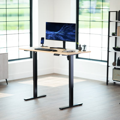 Sturdy ergonomic sit or stand active desk workstation with adjustable height using smart control panel.