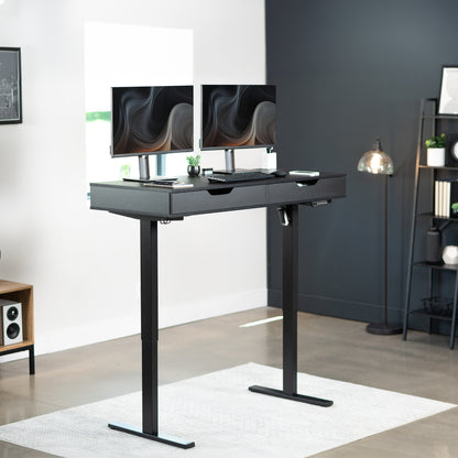 Heavy-duty electric height adjustable desk with drawers, built-in power strip, and memory controller.