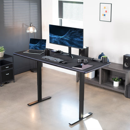 Large sturdy sit or stand active workstation with adjustable height using smart control panel featuring a full-size LED USB powered RGB pad.