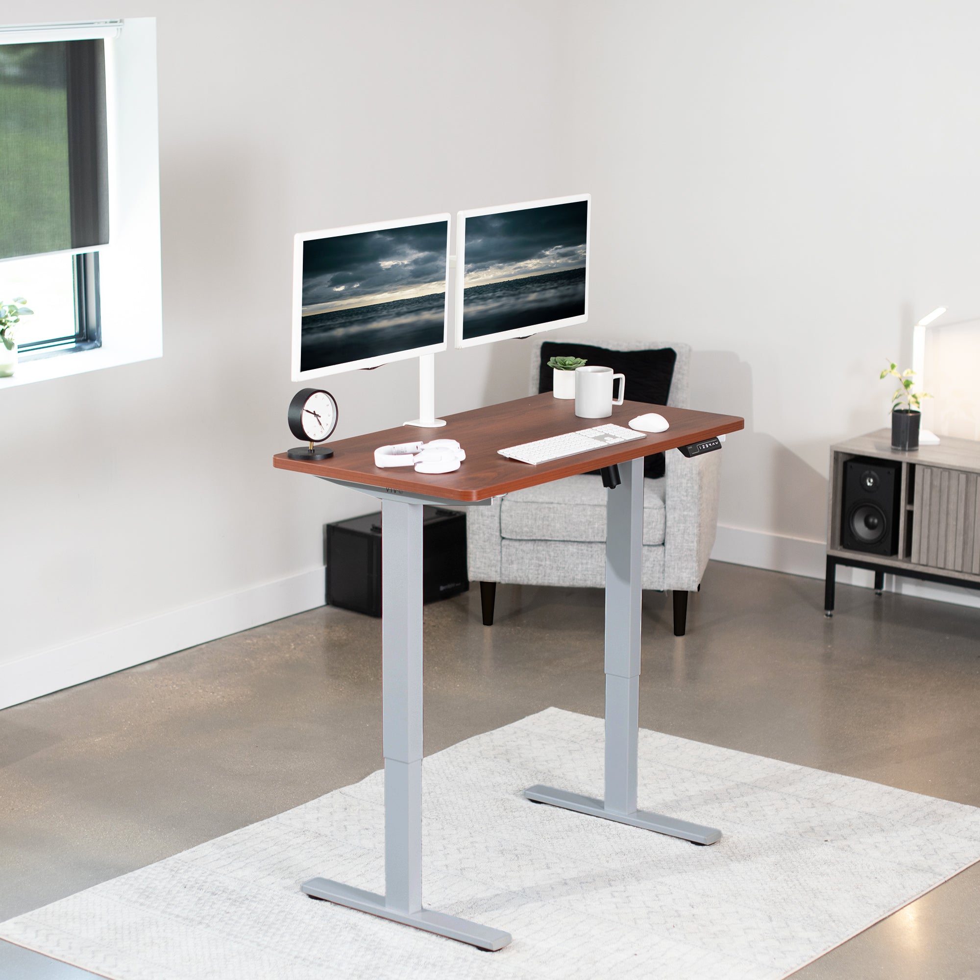 Sturdy ergonomic sit or stand active desk workstation with adjustable height using smart control panel.