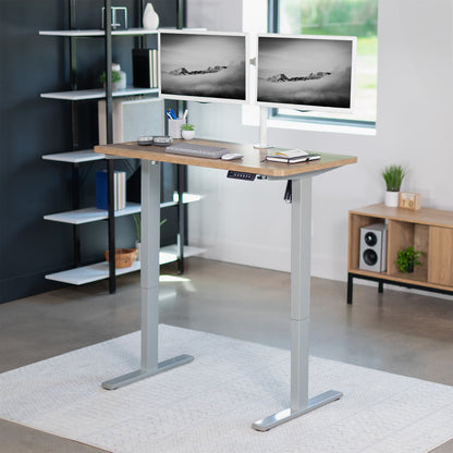 Sturdy ergonomic sit or stand active desk workstation with adjustable height using smart control panel.