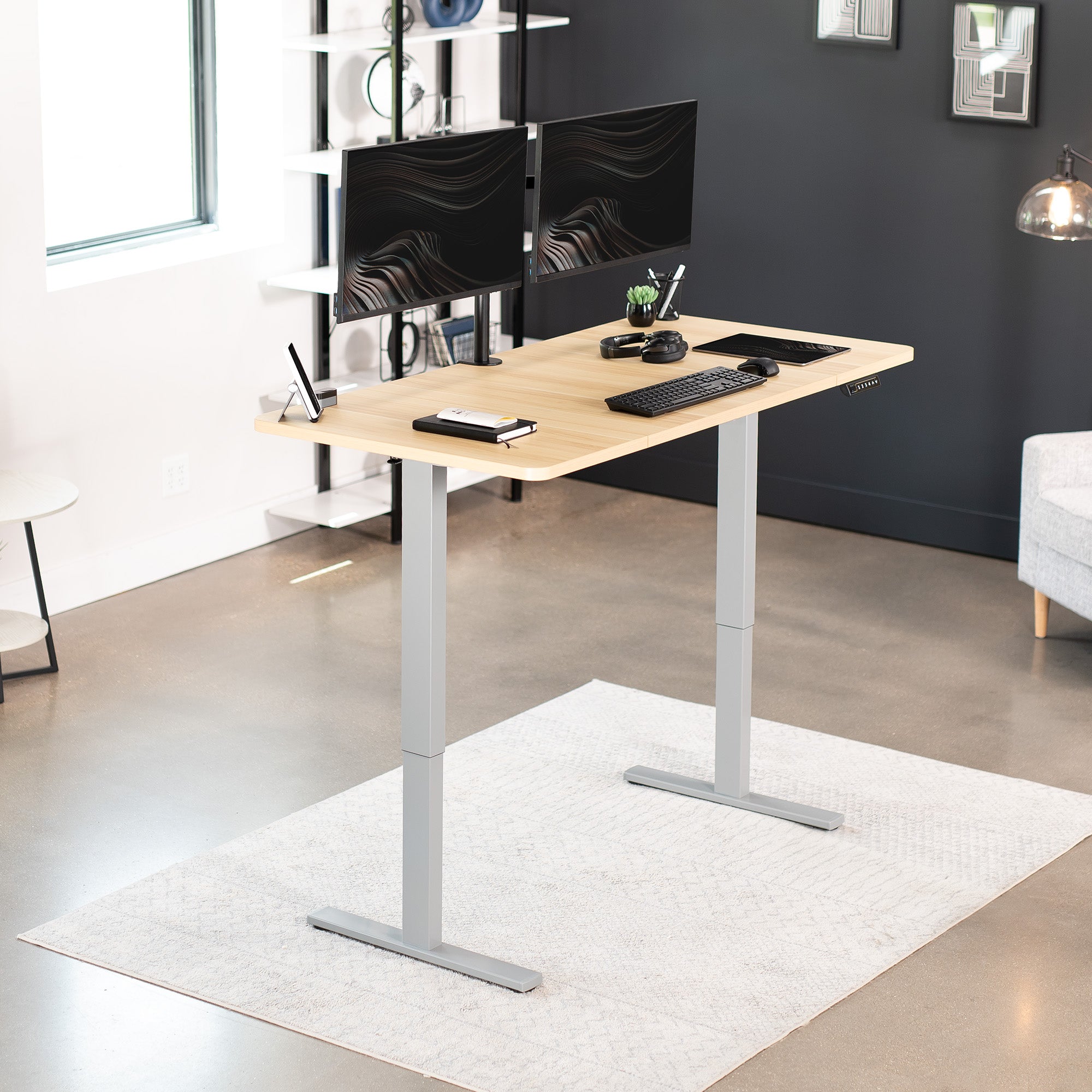 Sturdy ergonomic sit or stand active desk workstation with adjustable height using smart control panel.