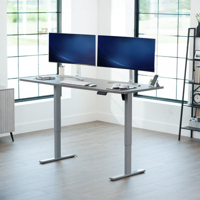 Large sturdy sit or stand modern desk with electric height adjustment options.