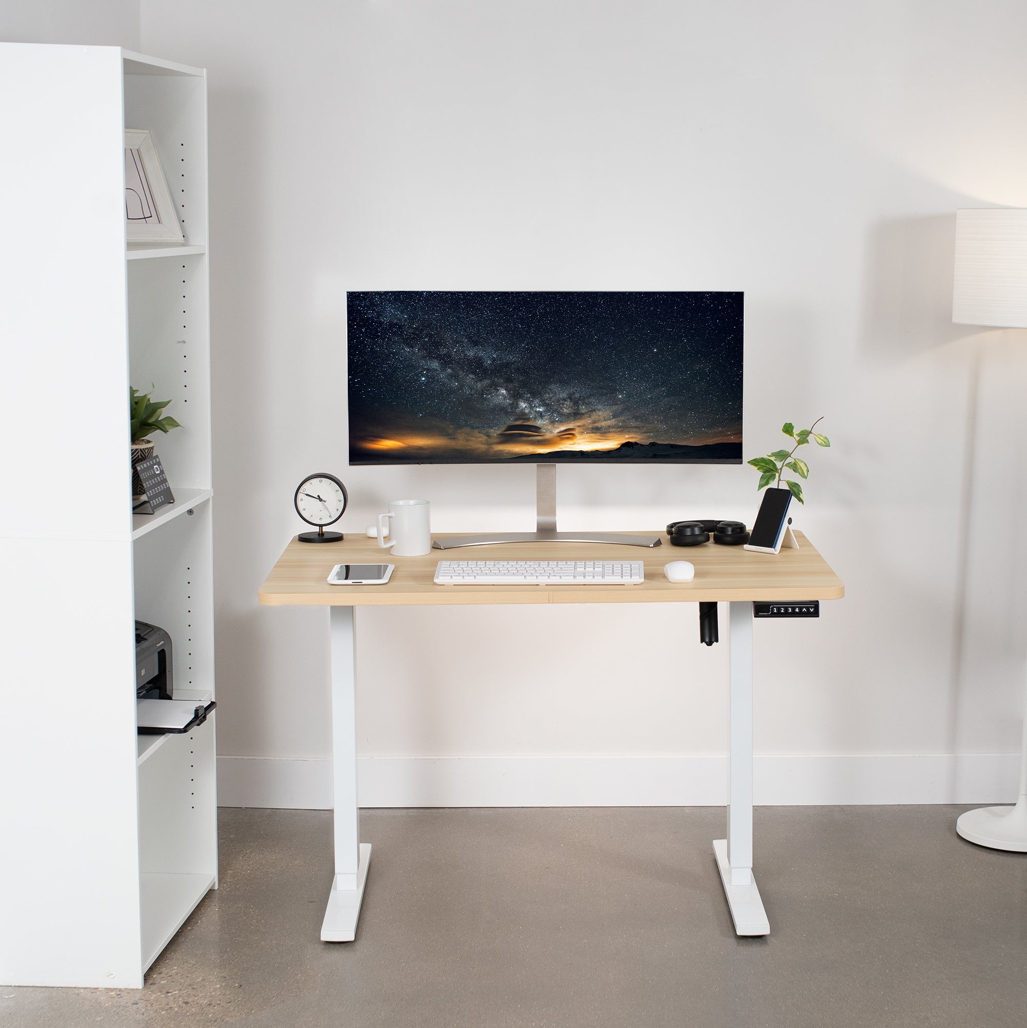 Sturdy ergonomic sit or stand active desk workstation with adjustable height using smart control panel.