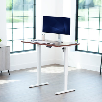 Sturdy ergonomic sit or stand active desk workstation with adjustable height using smart control panel.