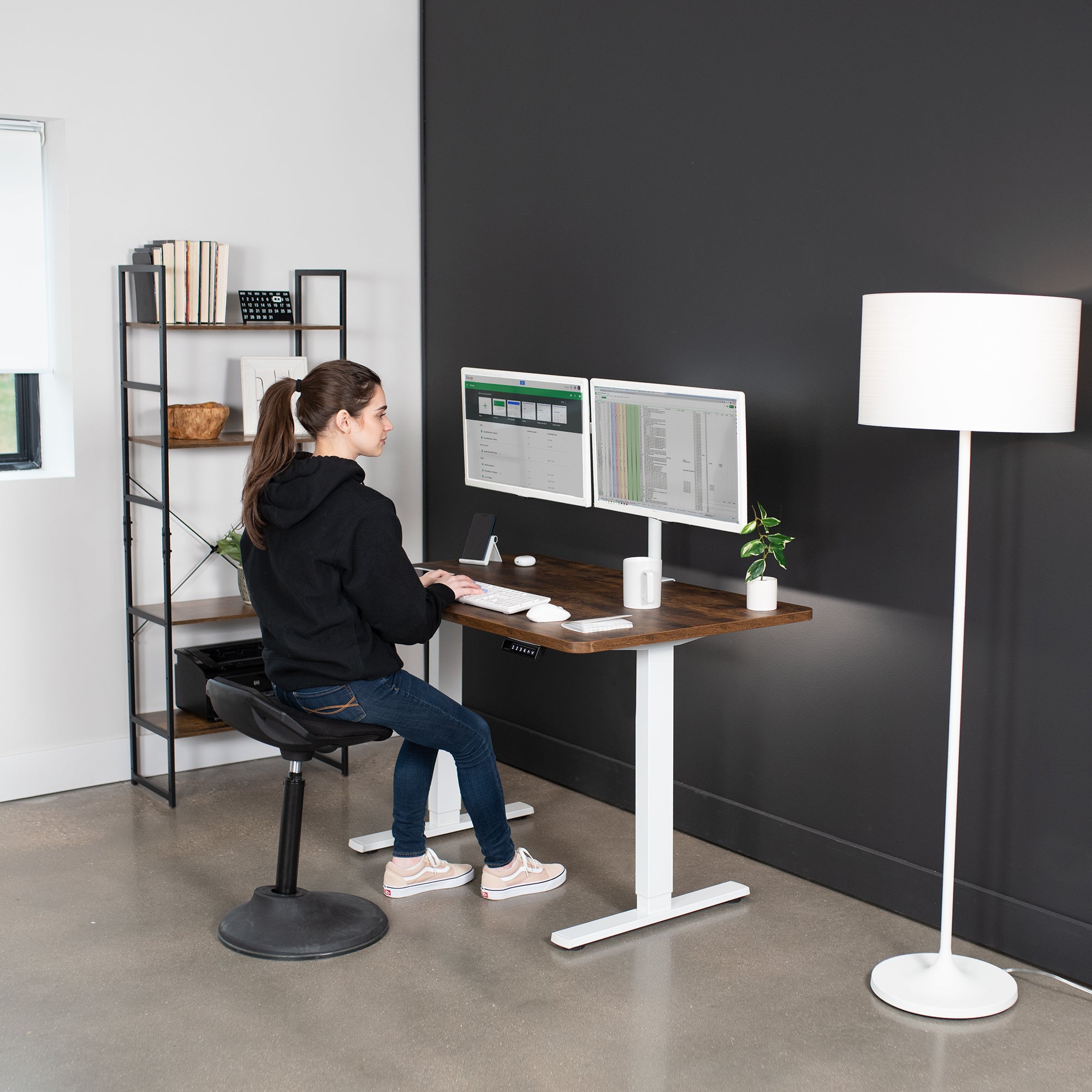 Rustic, sturdy ergonomic sit or stand active desk workstation with adjustable height using smart control panel.