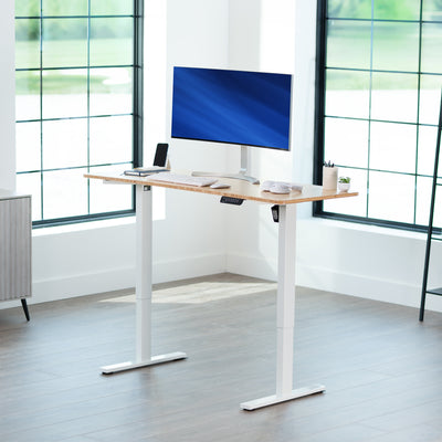 Sturdy ergonomic sit or stand active desk workstation with adjustable height using smart control panel.