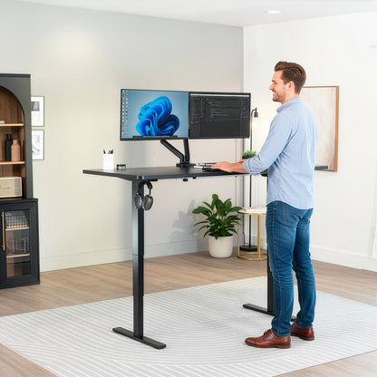Heavy-duty electric height adjustable desktop workstation for active sit or stand efficient workspace.