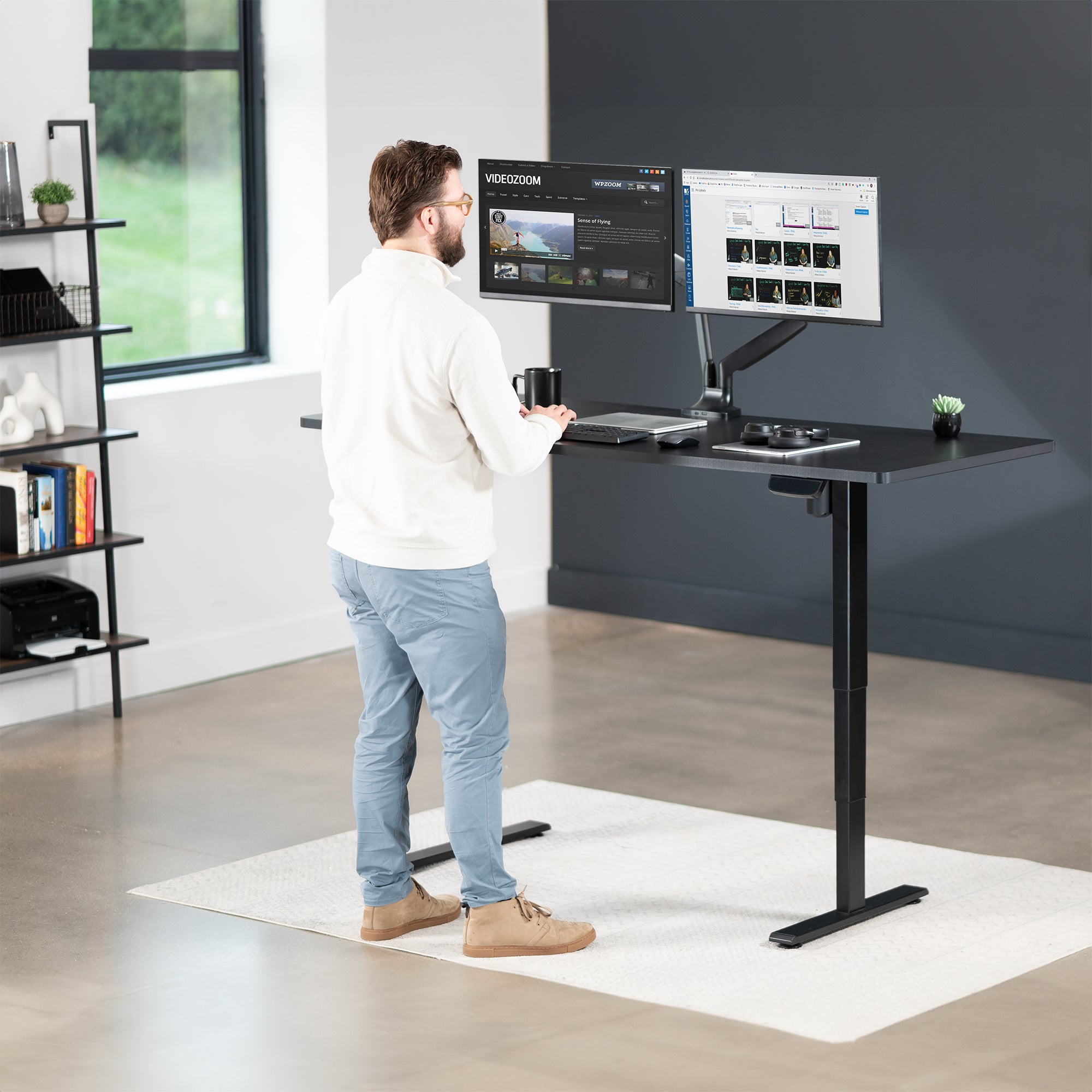 Heavy-duty electric height adjustable desktop workstation for active sit or stand efficient workspace.