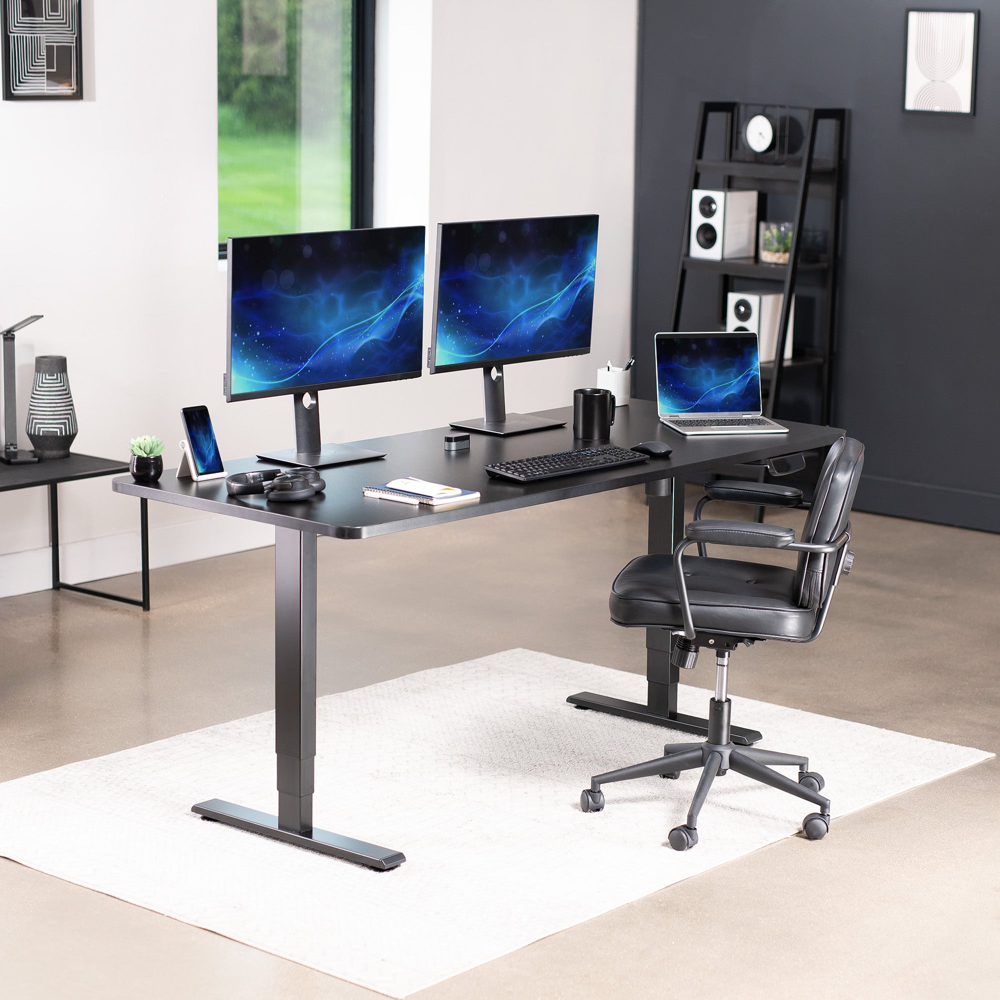 Heavy-duty electric height adjustable desktop workstation for active sit or stand efficient workspace.