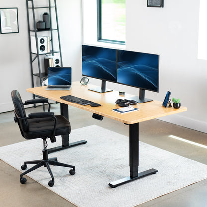 Heavy-duty electric height adjustable desktop workstation for active sit or stand efficient workspace.