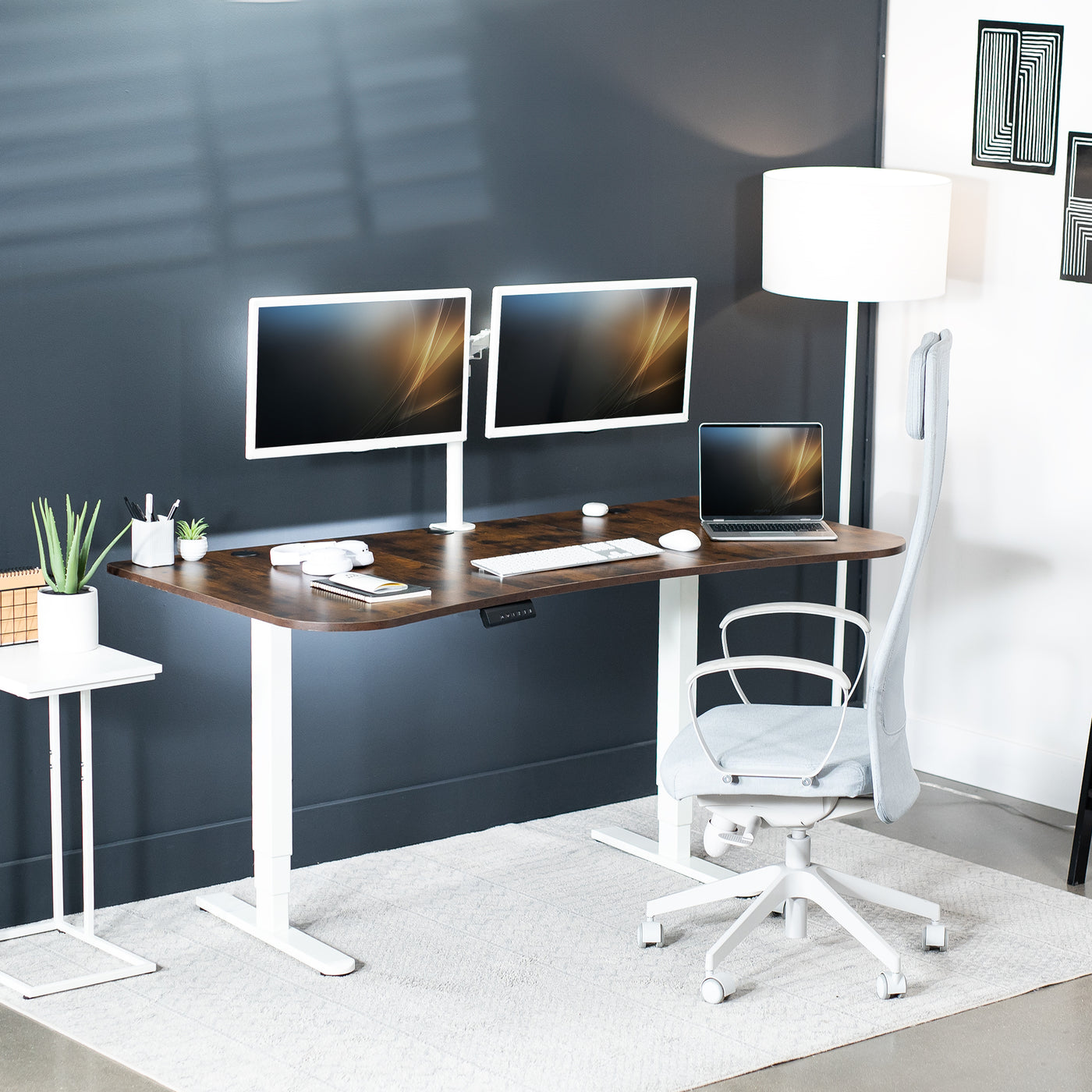 Large rustic standing desk featuring smooth height adjustment, powerful dual motors, and a simple push-button controller featuring memory presets.