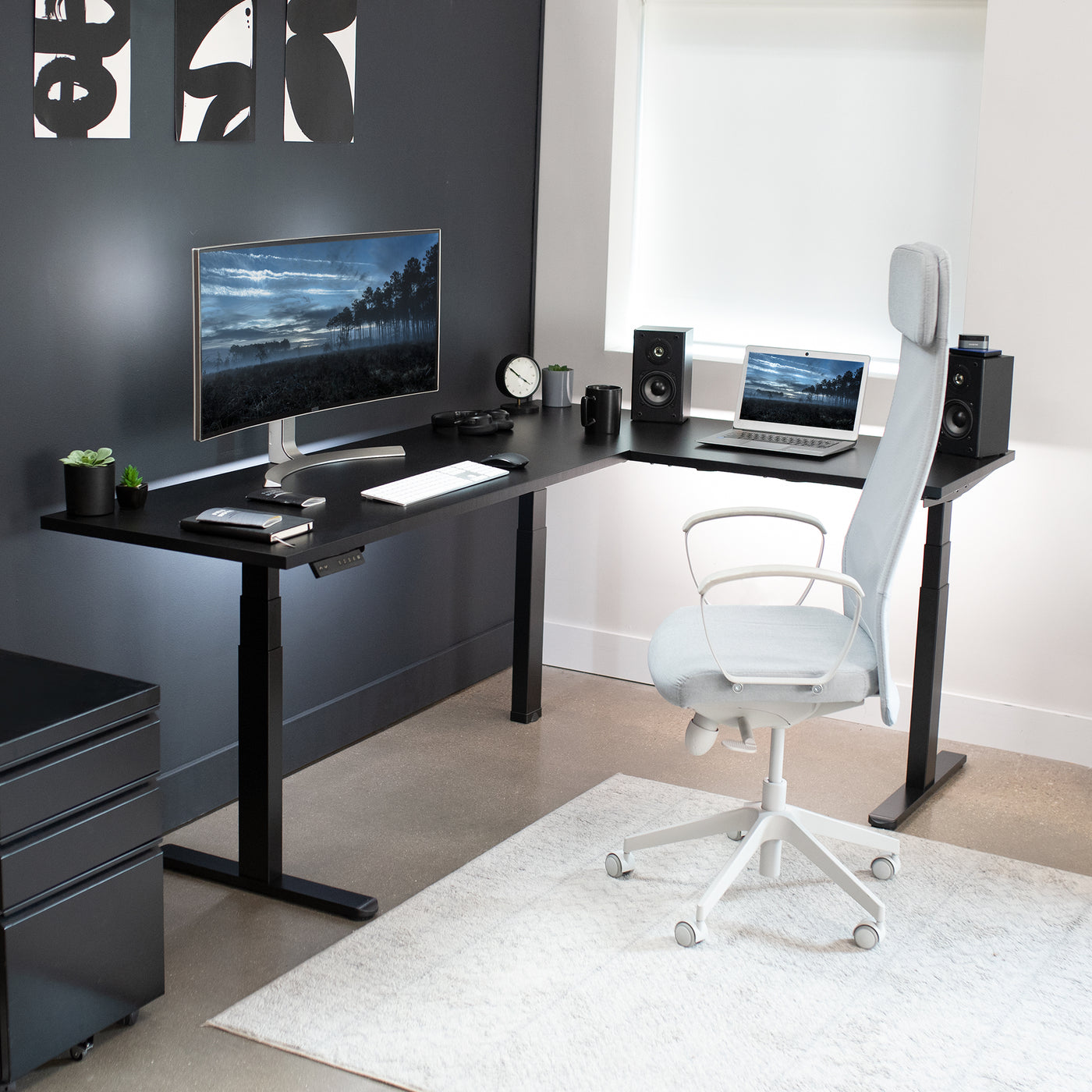 Large electric heavy-duty corner desk workstation for modern office workspaces.