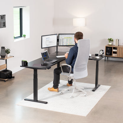 Large electric heavy-duty corner desk workstation for modern office workspaces.