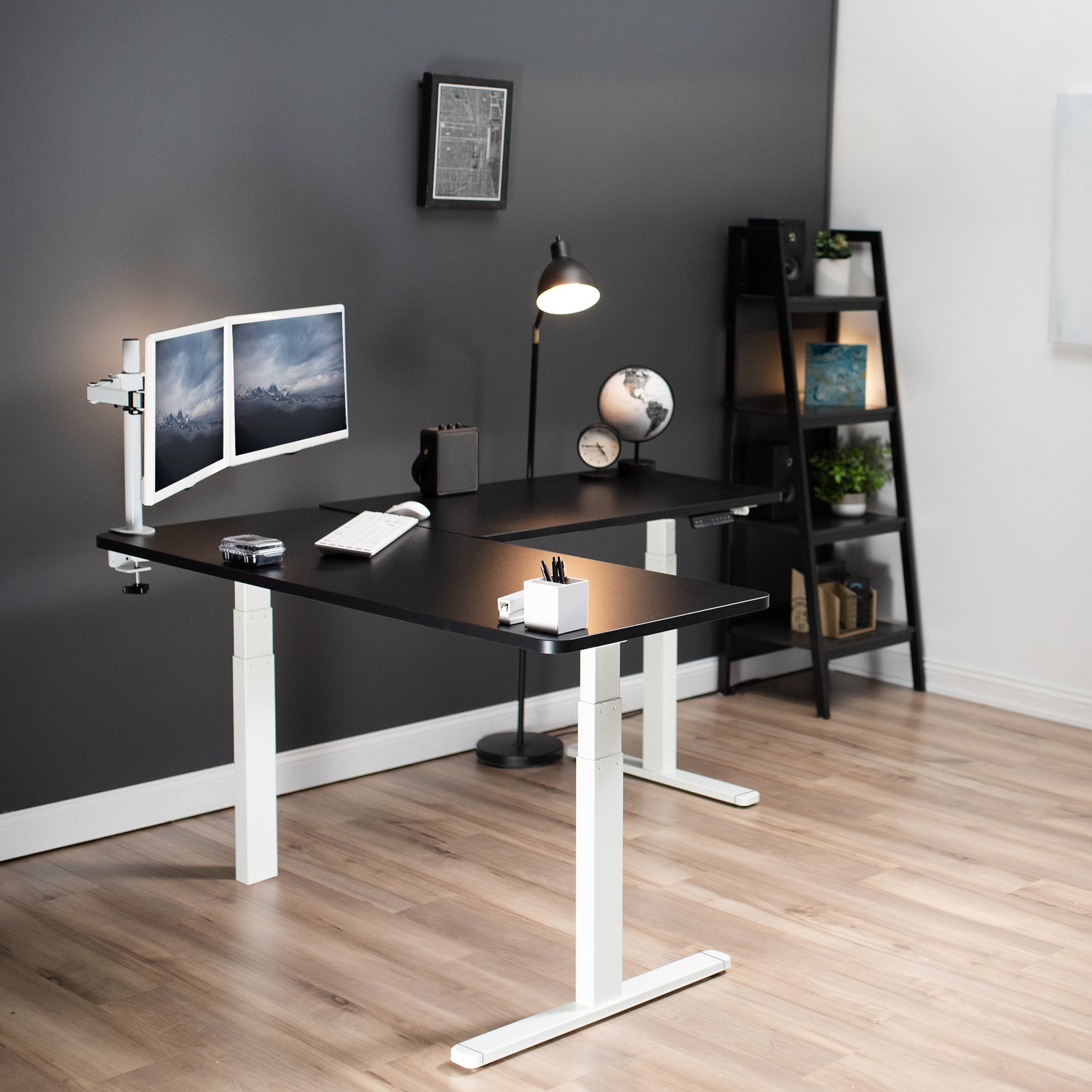 Heavy-duty electric height adjustable corner desk workstation for active sit or stand efficient workspace.