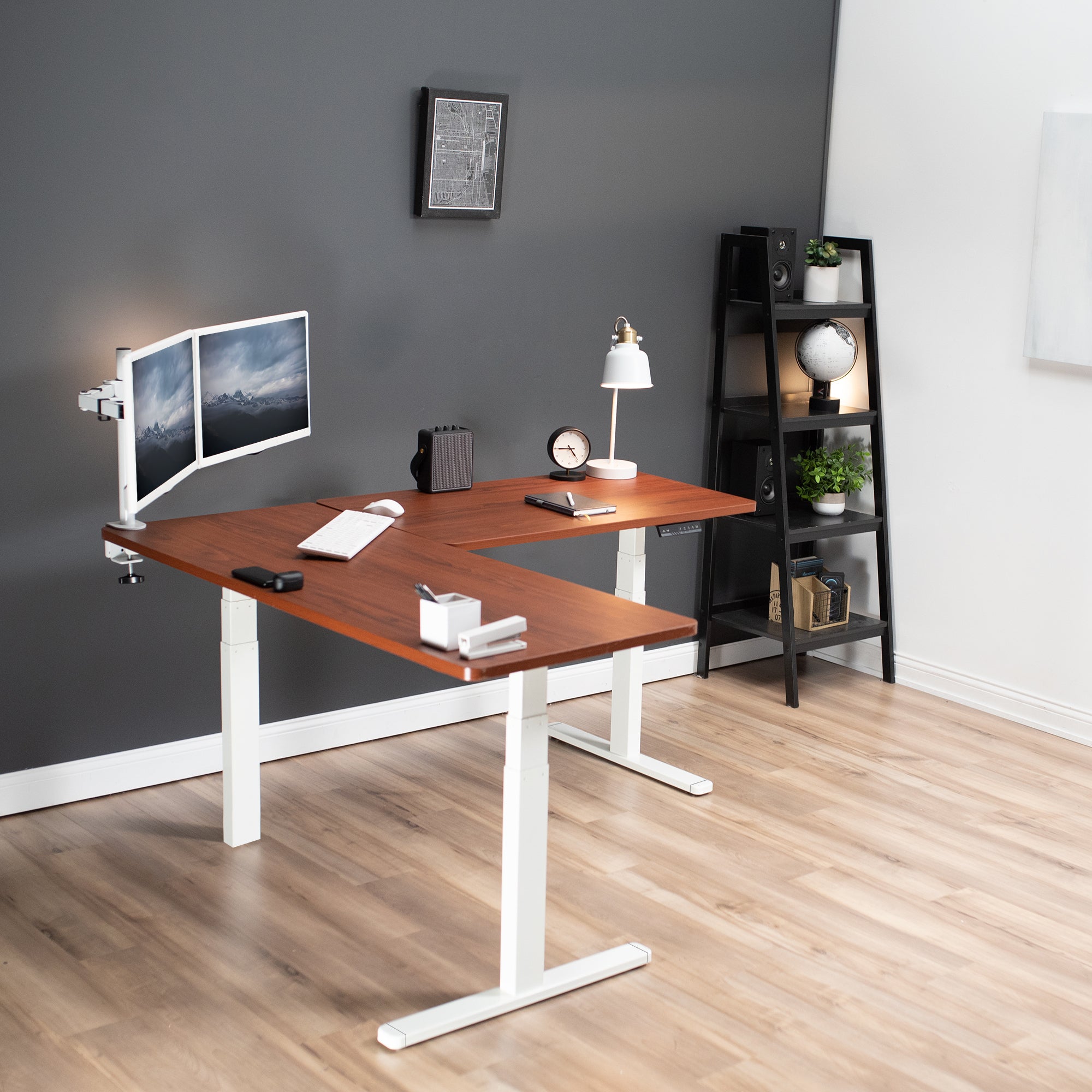 Heavy-duty electric height adjustable corner desk workstation for active sit or stand efficient workspace.