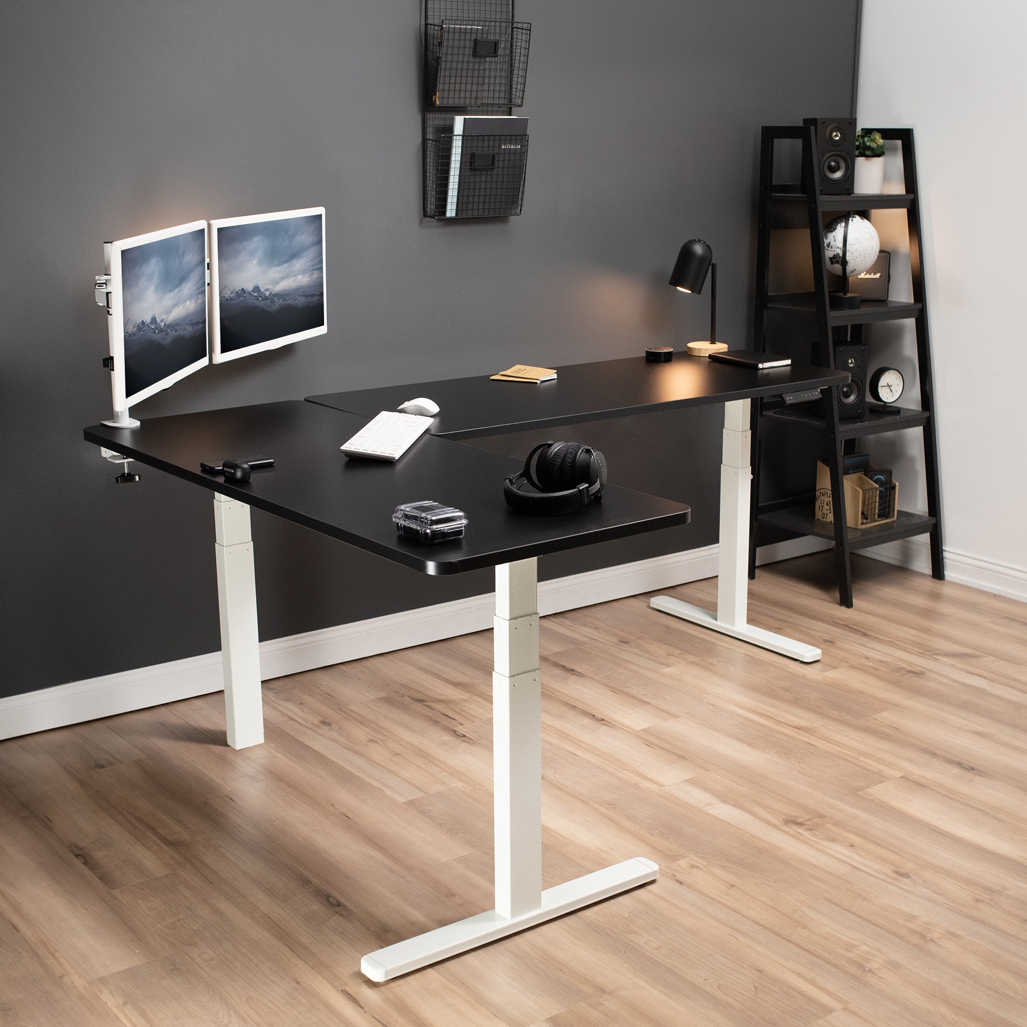 Large sturdy height adjustable corner desk workstation with memory controller.