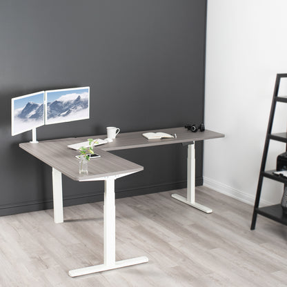 Large sturdy height adjustable corner desk workstation with memory controller.