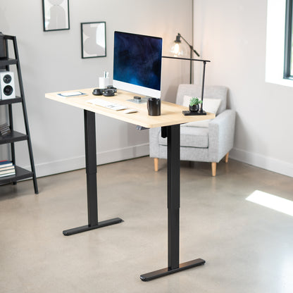 Heavy-duty electric height adjustable desktop workstation for active sit or stand efficient workspace.