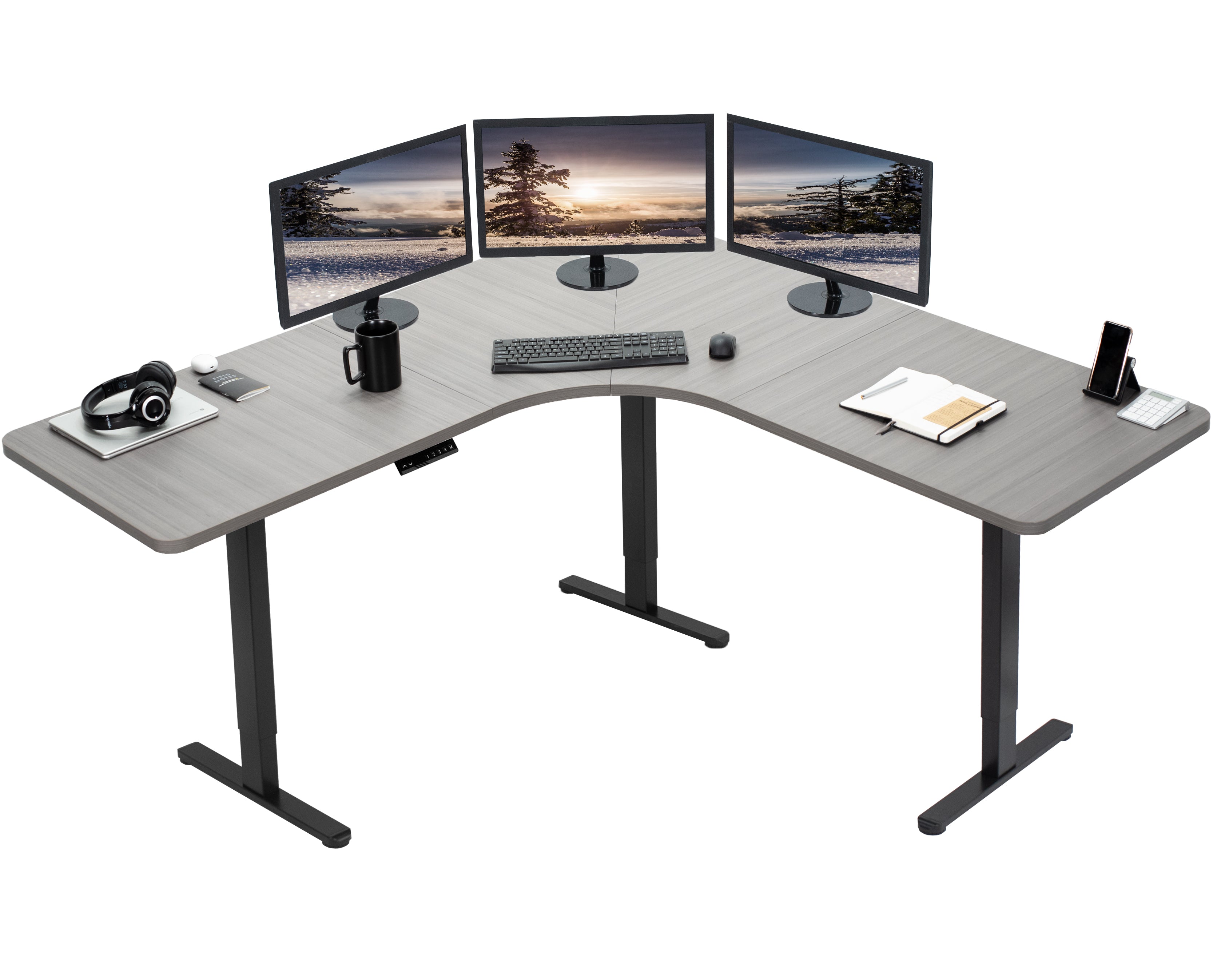 Large heavy-duty electric height adjustable corner desk workstation with programmable memory controller.