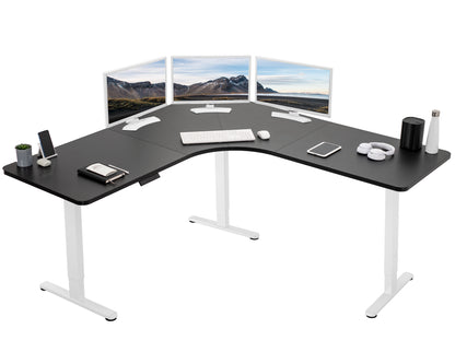 Large heavy-duty electric height adjustable corner desk workstation with programmable memory controller.