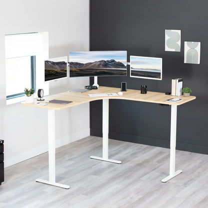 Large heavy-duty electric height adjustable corner desk workstation with programmable memory controller.