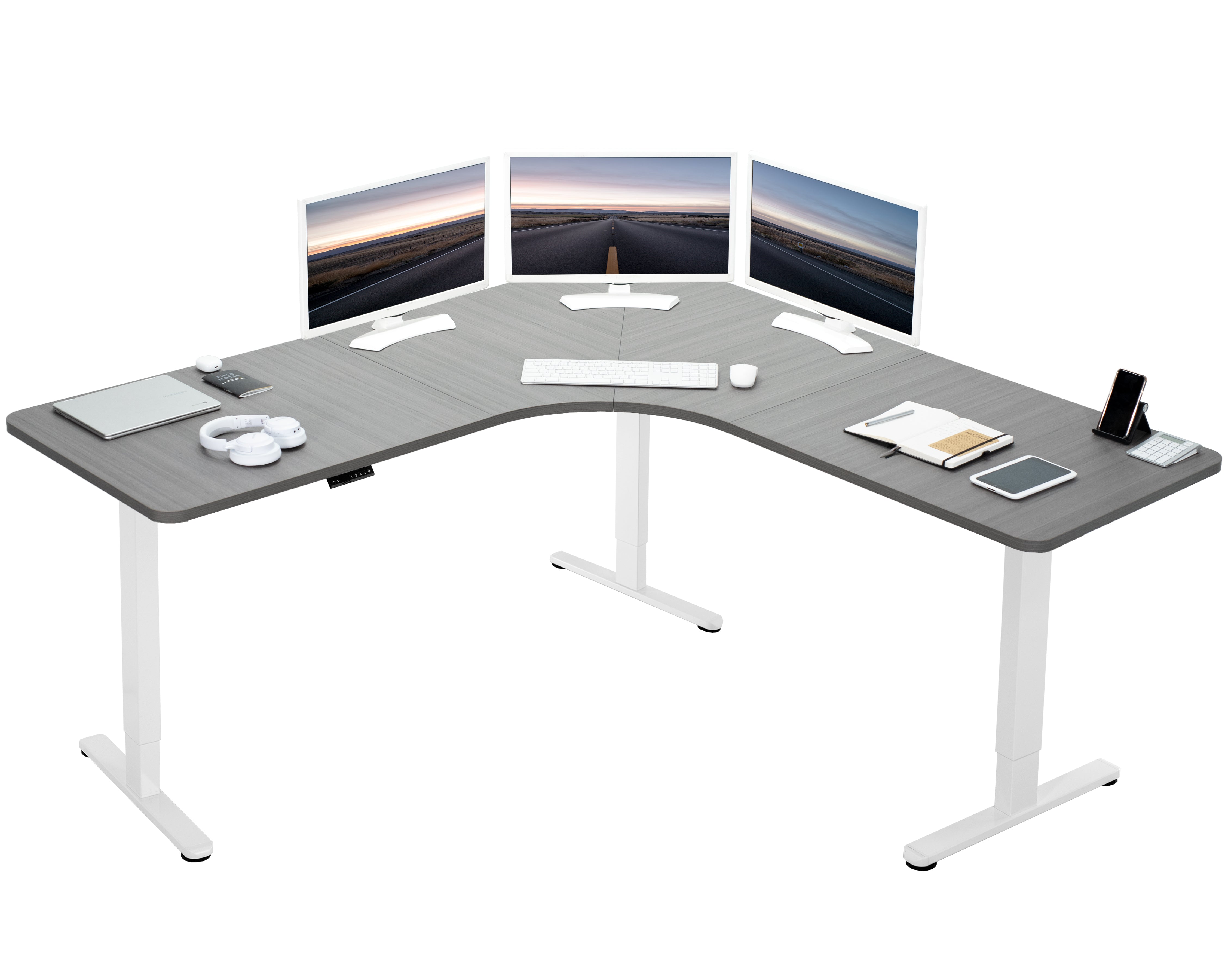 Large heavy-duty electric height adjustable corner desk workstation with programmable memory controller.