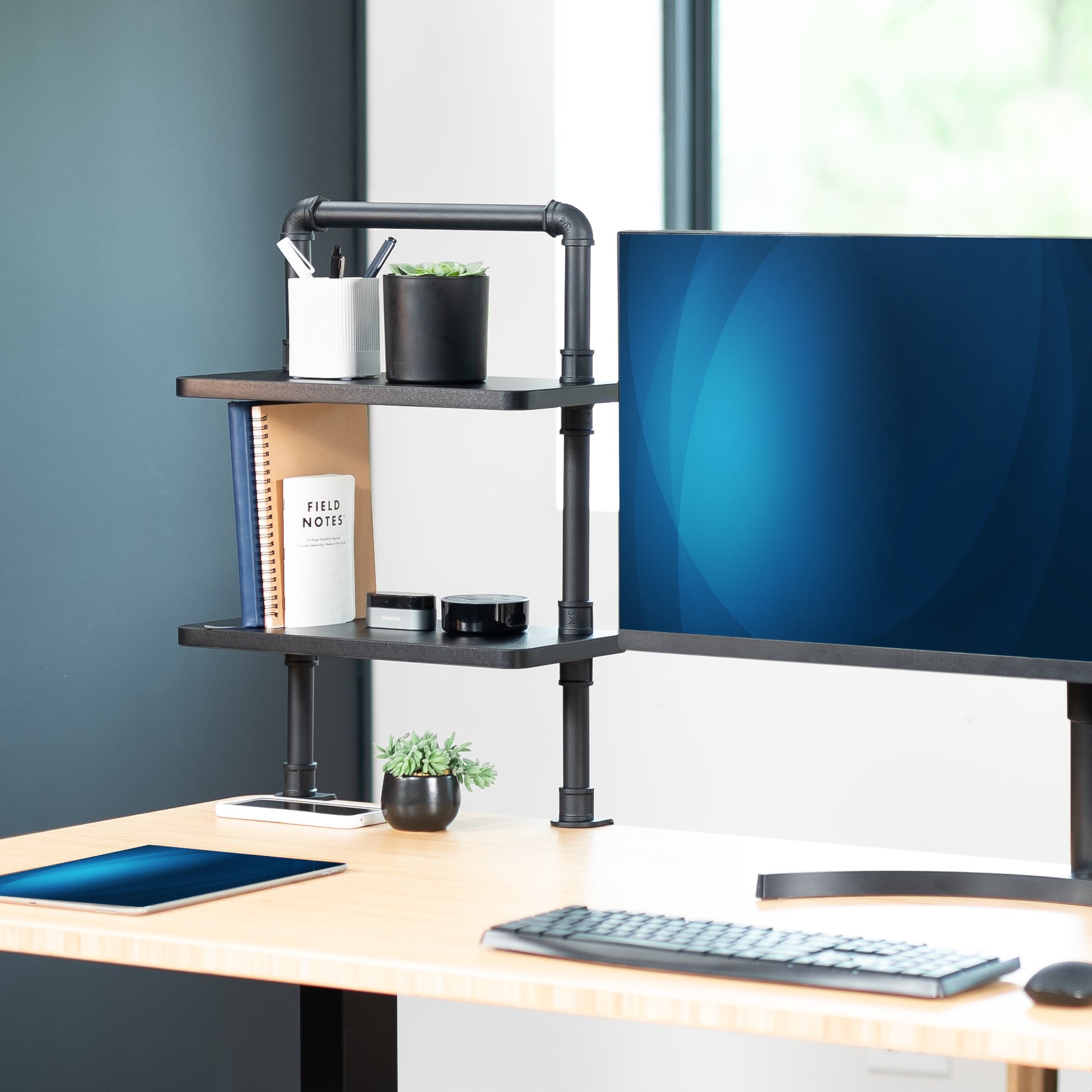 Clamp-on Industrial Pipe Shelves secure to your office desk and create dual level storage for clearing workspace clutter.