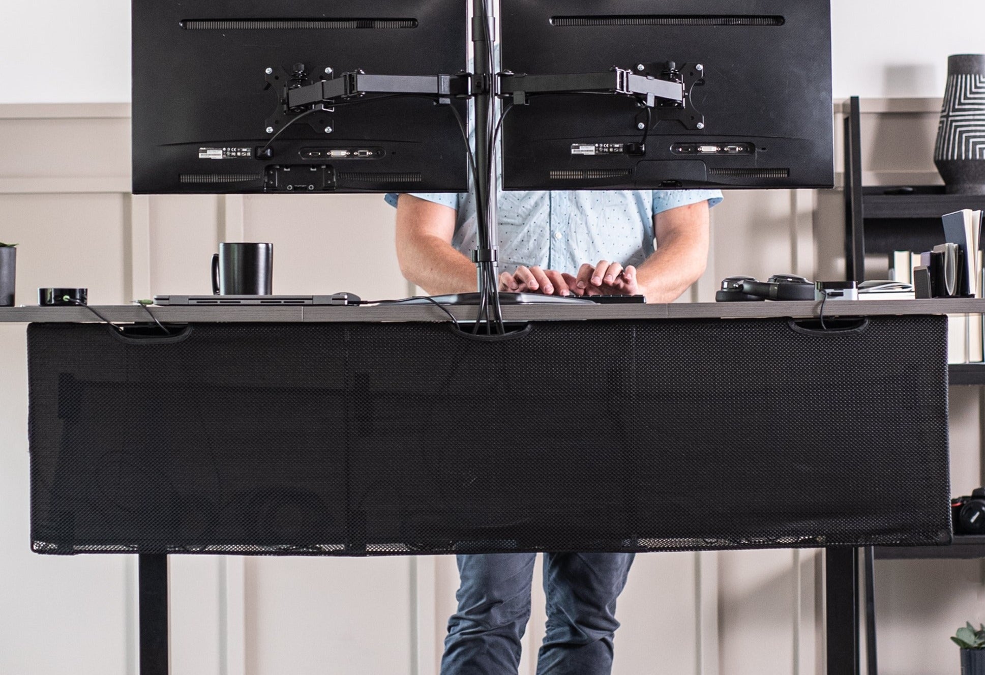 Black Cable Management Desk Organizer helps reduce workspace clutter by routing and concealing cables and power strips.