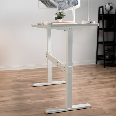 White support clamp on bar with white frame desk.