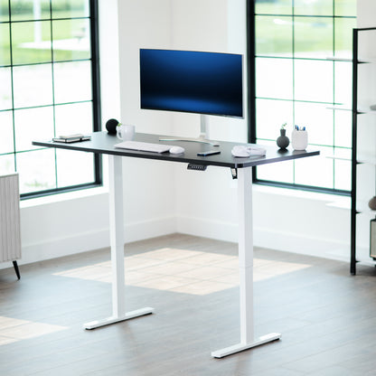 Durable tabletop for sit-stand desk workstation with wide surface.
