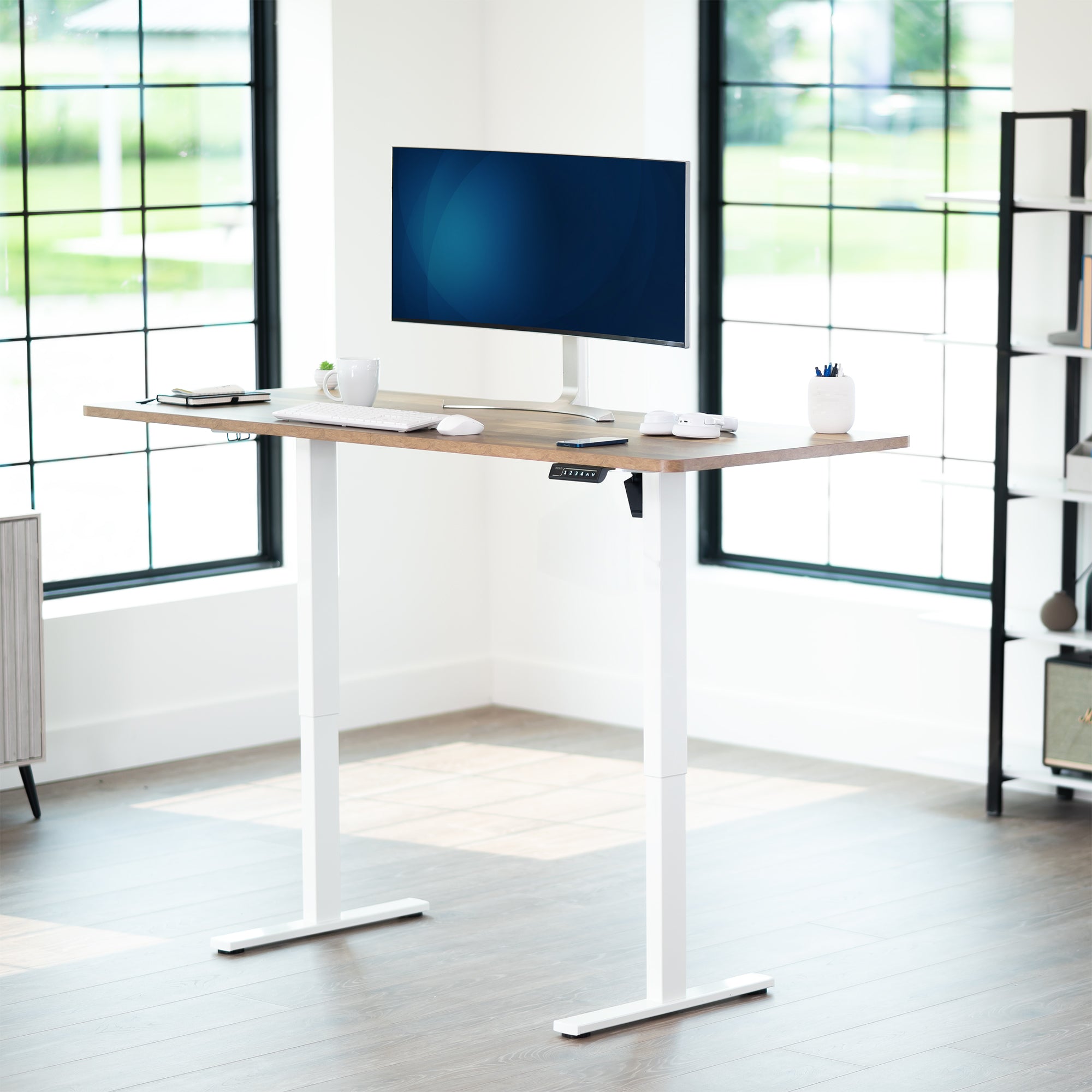 Durable tabletop for sit-stand desk workstation with wide surface.