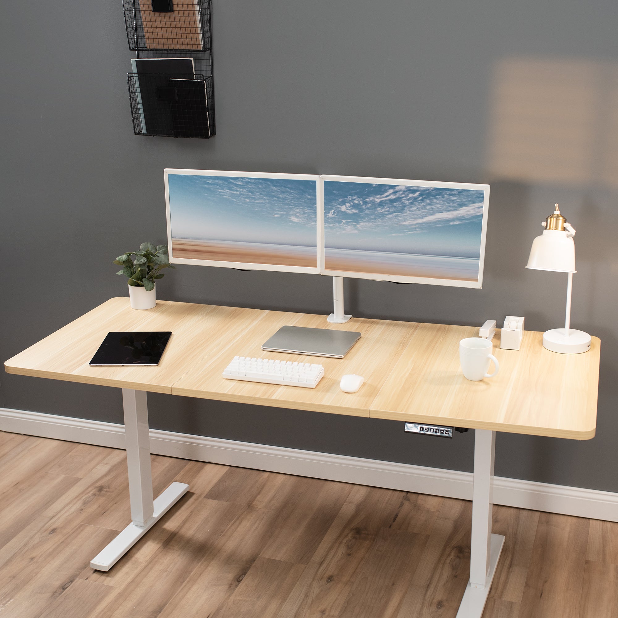 Durable sit to stand desk tabletop workstation with wide surface space.