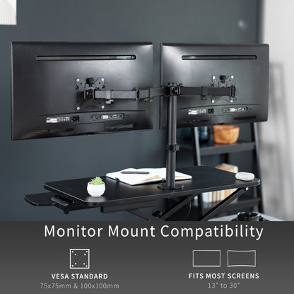 Sturdy height adjustable desk converter with articulating dual monitor mount.