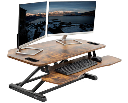 Heavy-duty height adjustable desk converter monitor riser with 2 tiers.