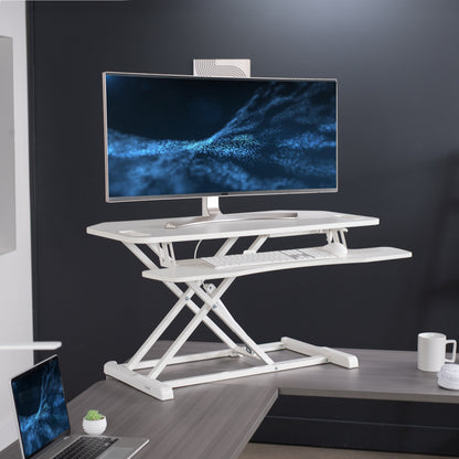 Heavy-duty height adjustable desk converter monitor riser with 2 tiers.